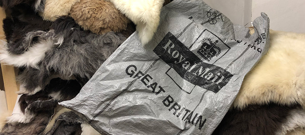 Royal Mail posting sack on some sheepskin rugs