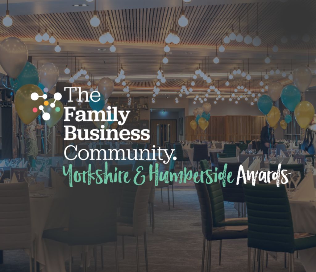 Family Business Awards logo in front of empty awards dinner set up