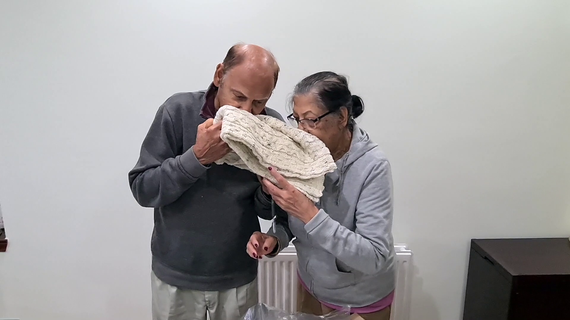 Couple smelling a British Wool scarf