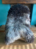 Grey sheepskin rug on chair