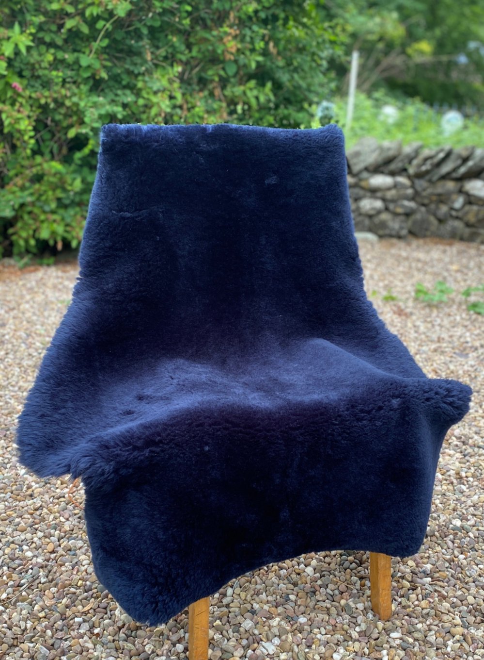 Navy short haired sheepskin rug on chair