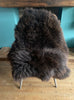Brown sheepskin rug on chair