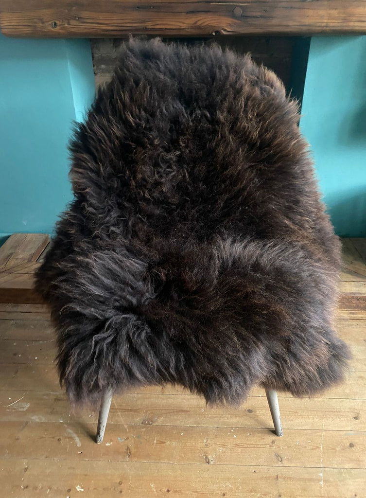 Brown sheepskin rug on chair