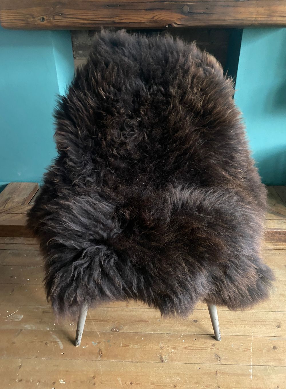 Brown sheepskin rug on chair