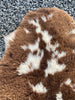 Brown and cream sheepskin rug close up