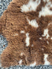 Brown and cream sheepskin rug close up