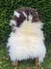 Brown and cream sheepskin on chair 