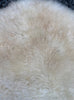 Cream sheepskin rug close up