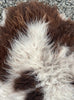 Brown and grey sheepskin rug close up 