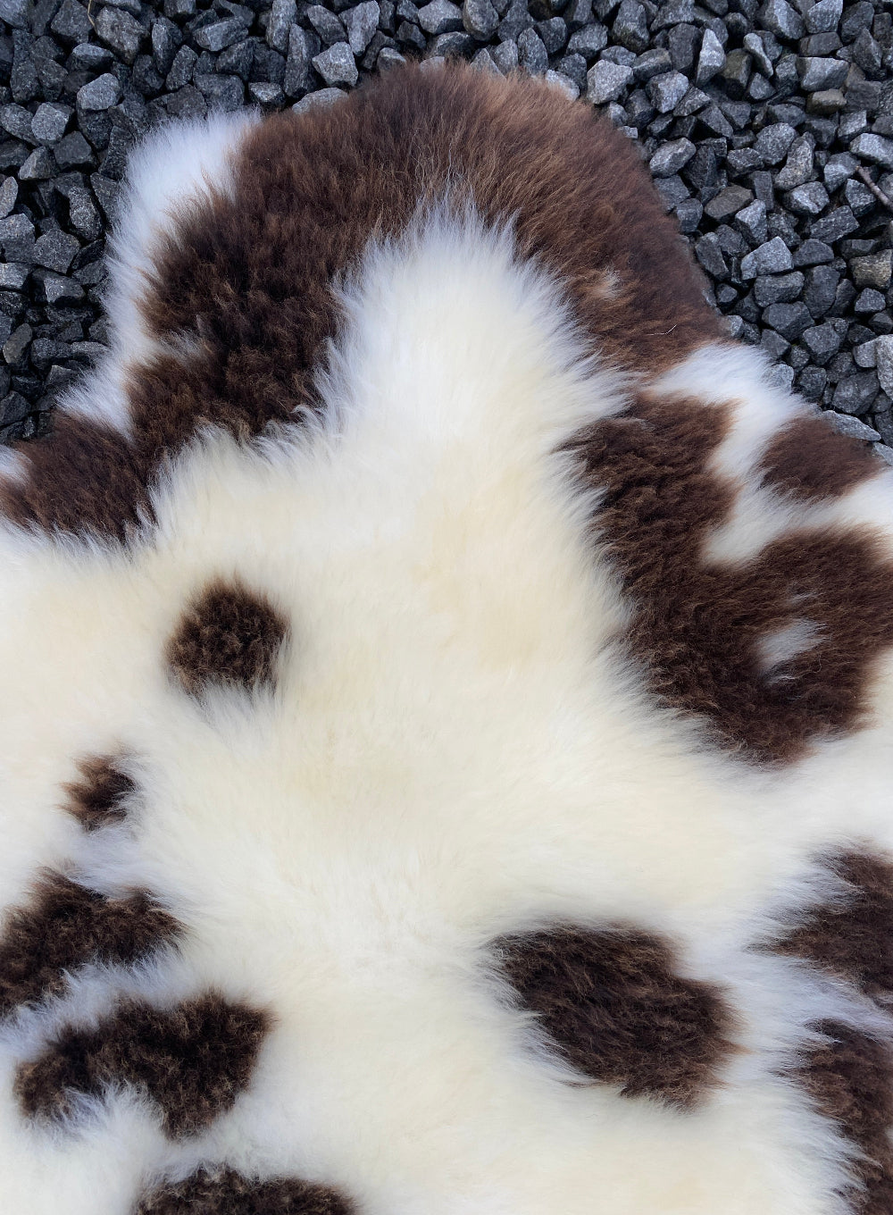 Cream and brown spotty sheepskin rug close  up 