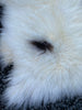 Cream and brown sheepskin rug close up