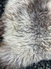 Brown and beige sheepskin rug close up 