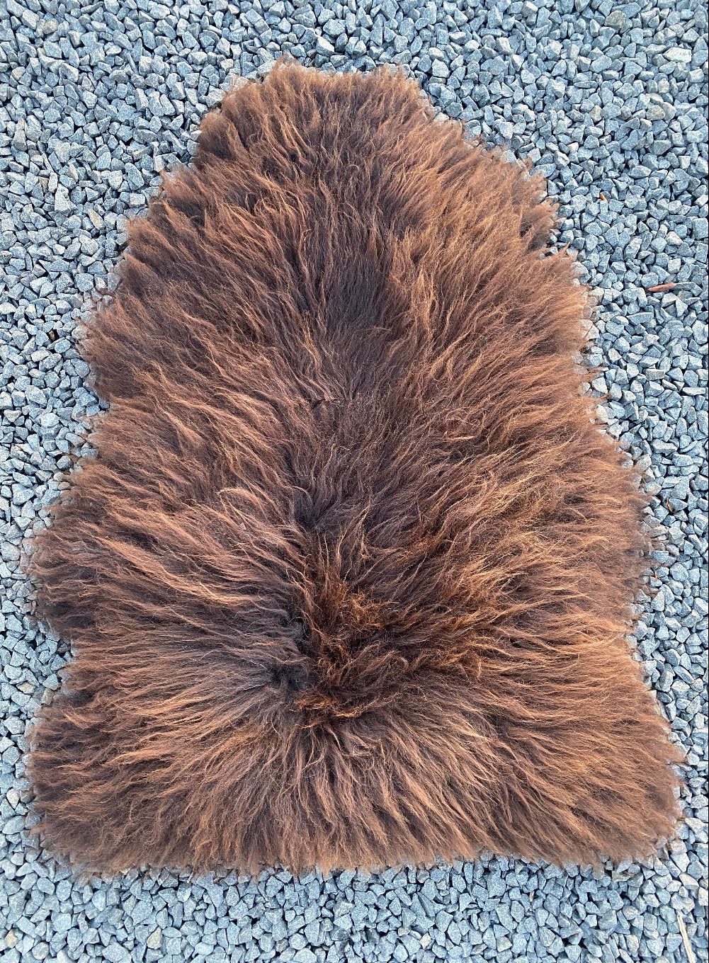 Brown sheepskin rug laid flat