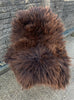 Brown sheepskin rug on chair