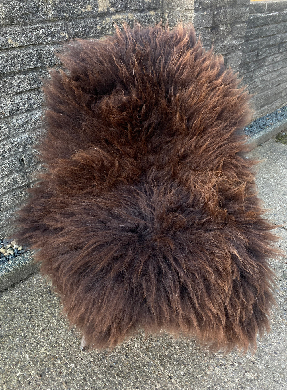 Brown sheepskin rug on chair