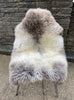 Grey and brown sheepskin rug on chair
