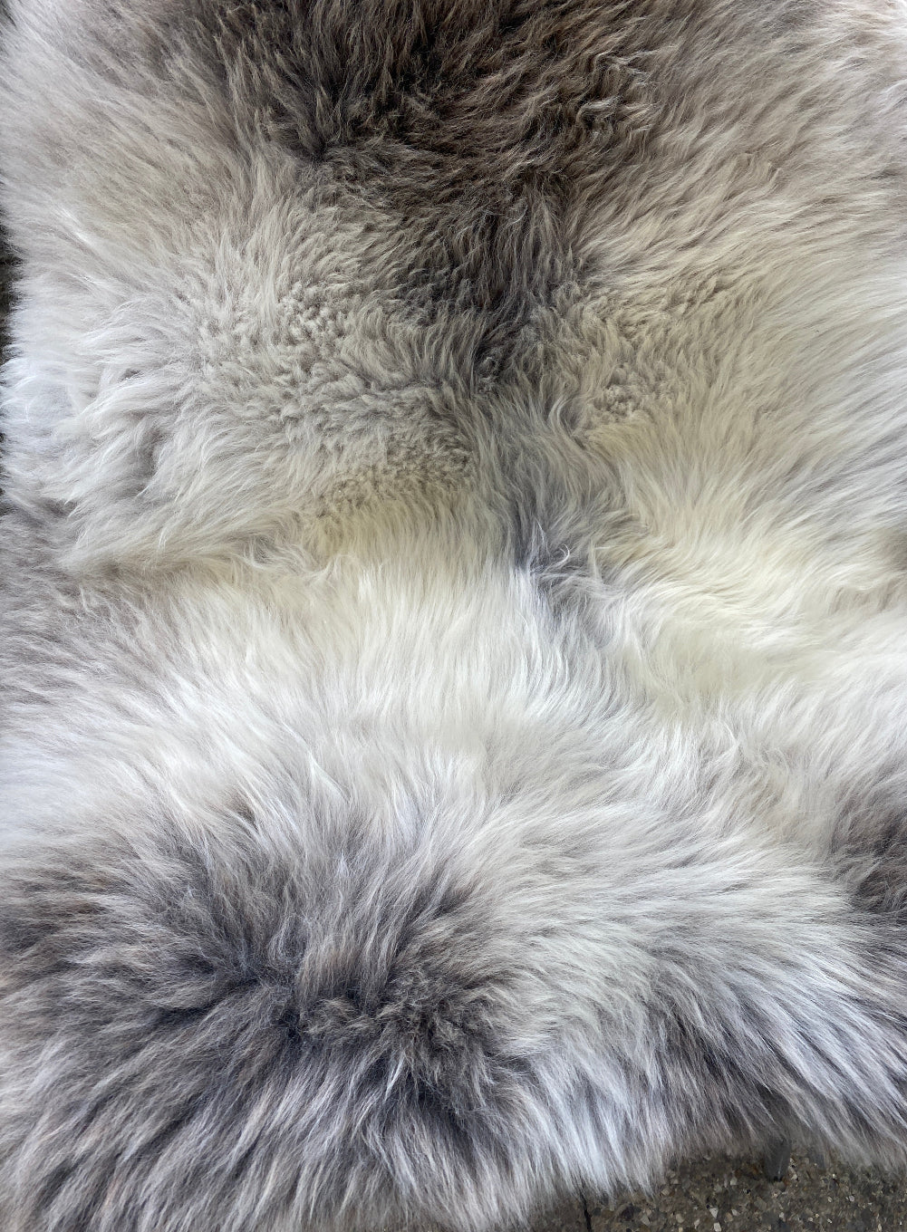 Grey sheepskin rug close up 