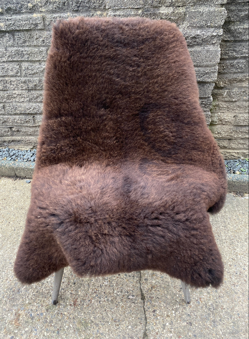 Brown sheepskin rug on chair