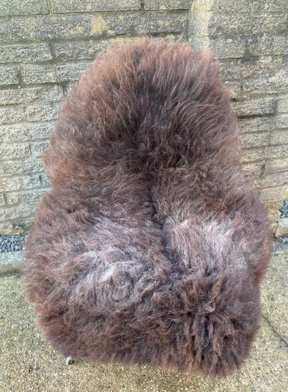 Brown sheepskin rug on chair