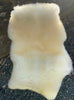Cream sheepskin rug on chair