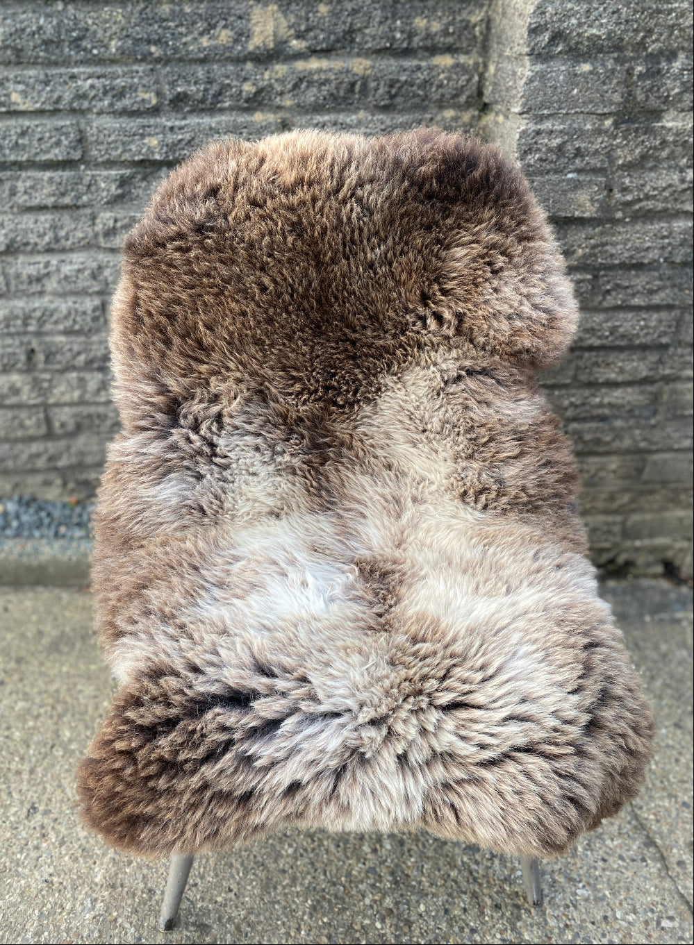 brown and cream sheepskin rug