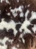 Brown and cream sheepskin rug close up