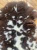 Brown and cream sheepskin rug close up