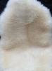 Cream sheepskin rug close up