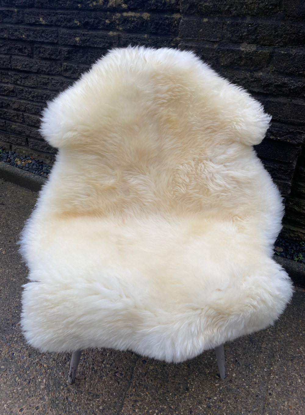 Cream sheepskin rug on chair