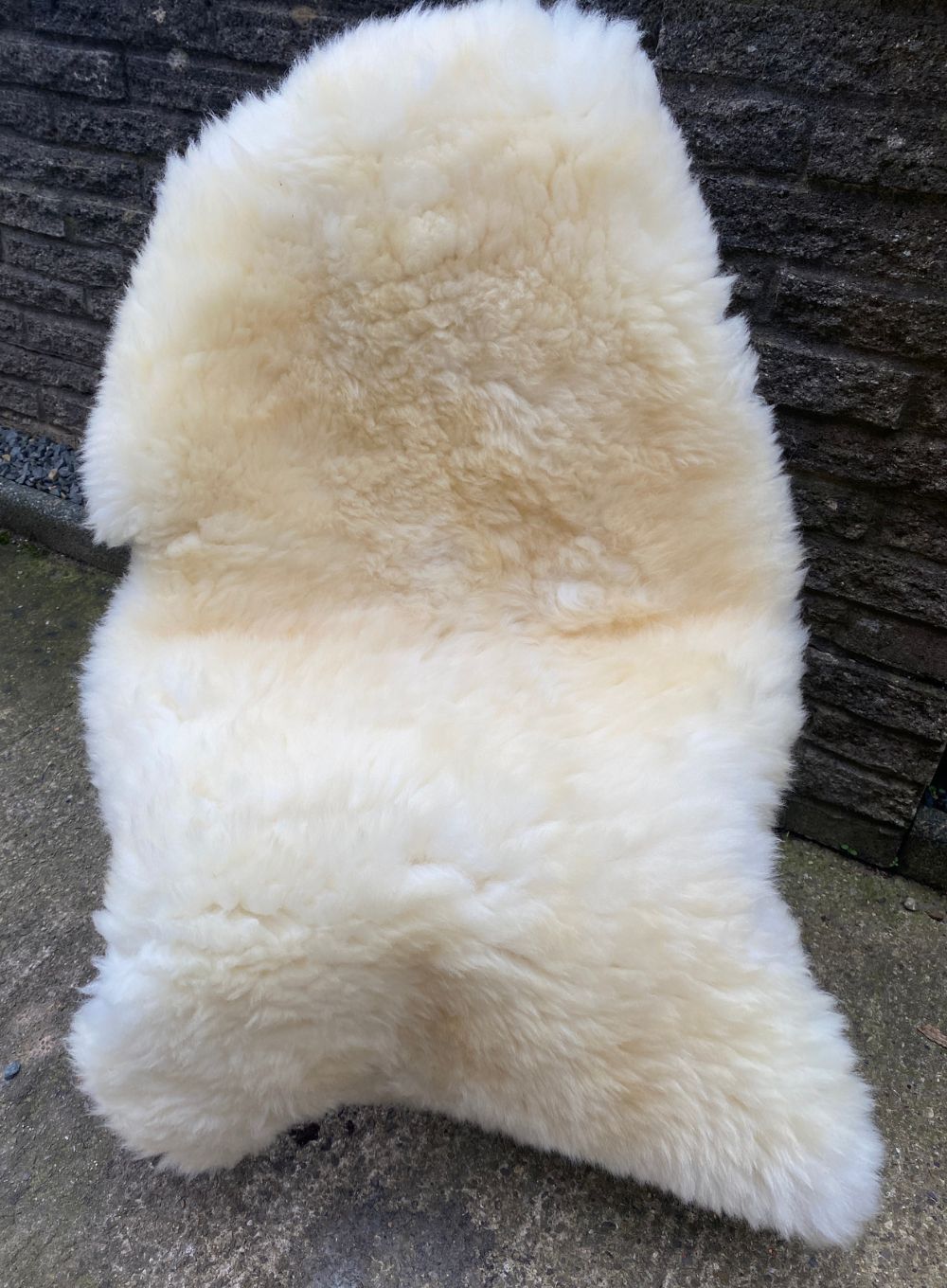 Cream sheepskin rug on chair