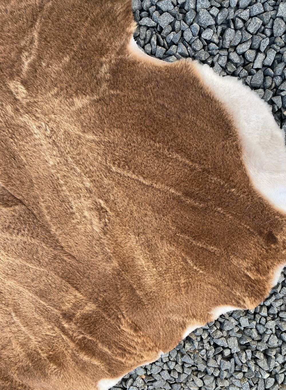 Brown short wooled triple sheepskin rug close up