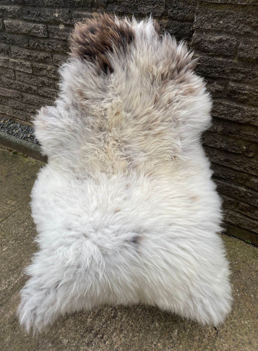 Cream and brown sheepskin rug