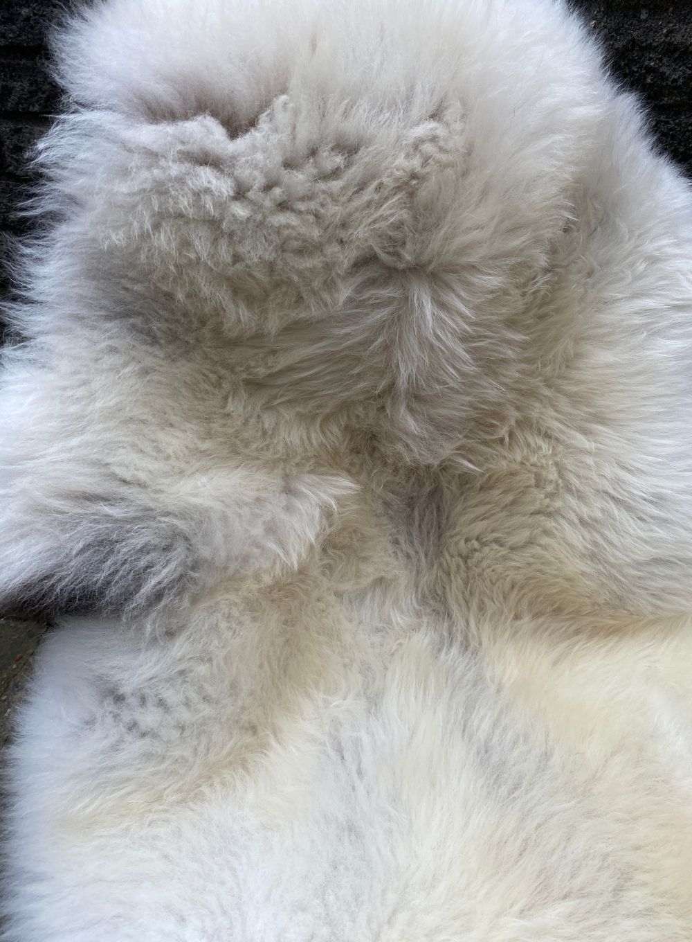 Cream sheepskin rug close up
