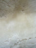 Cream sheepskin rug close up