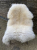 Cream sheepskin rug on chair