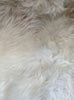 Cream speckled sheepskin rug close up