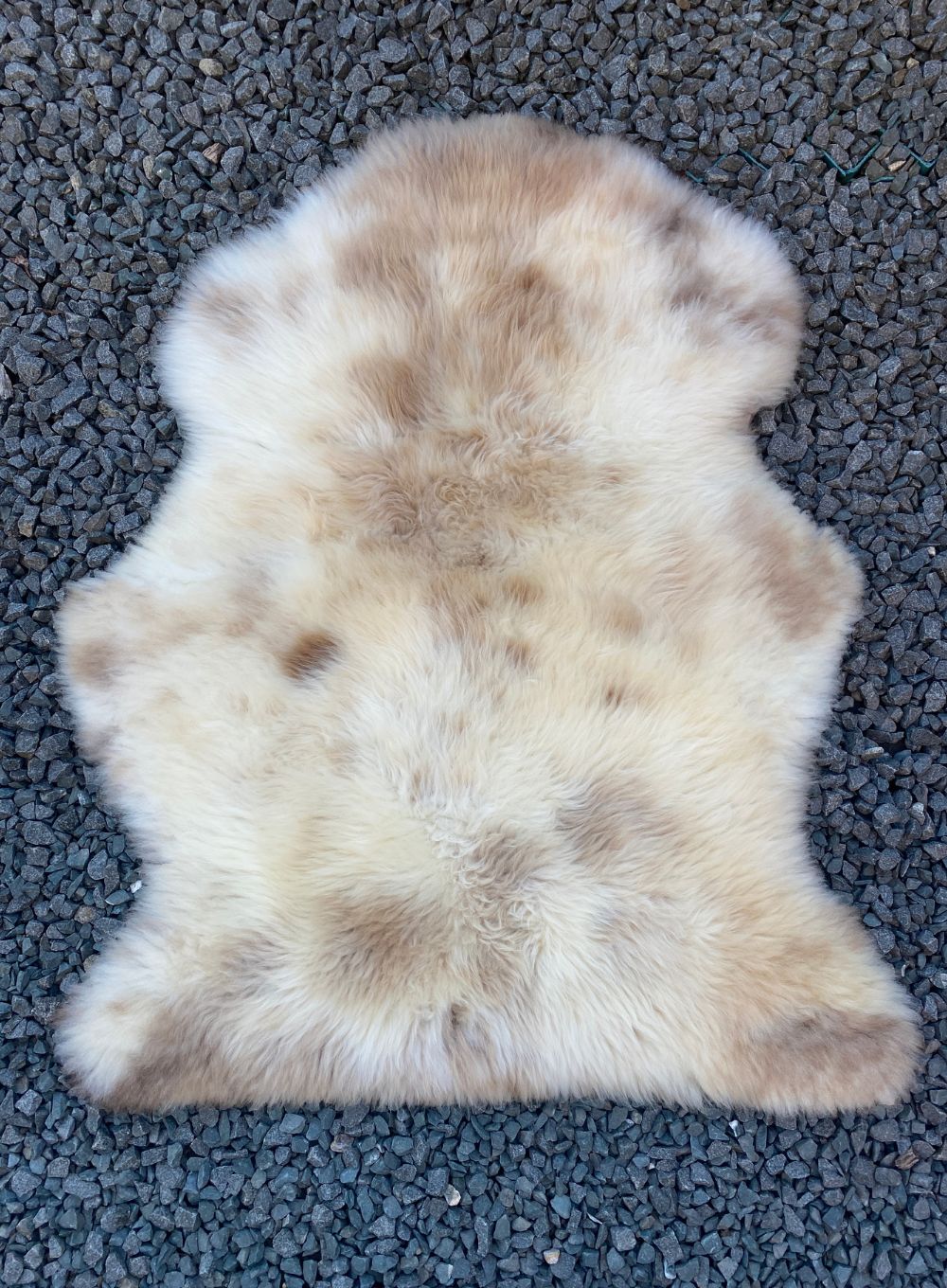 Cream speckled sheepskin rug flat 