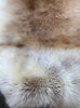 Cream speckled sheepskin rug close up