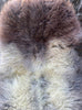 Brown and grey sheepskin rug close up