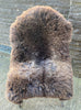 Brown sheepskin rug on chair