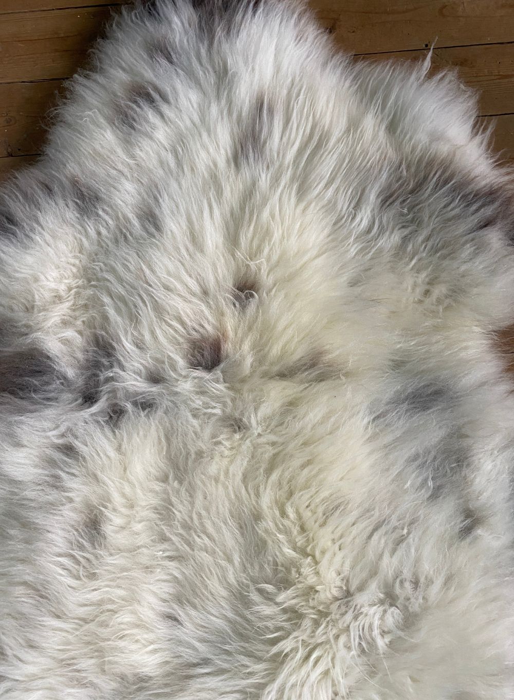 Cream speckled sheepskin close up 