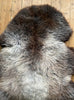 Brown and grey sheepskin rug close up