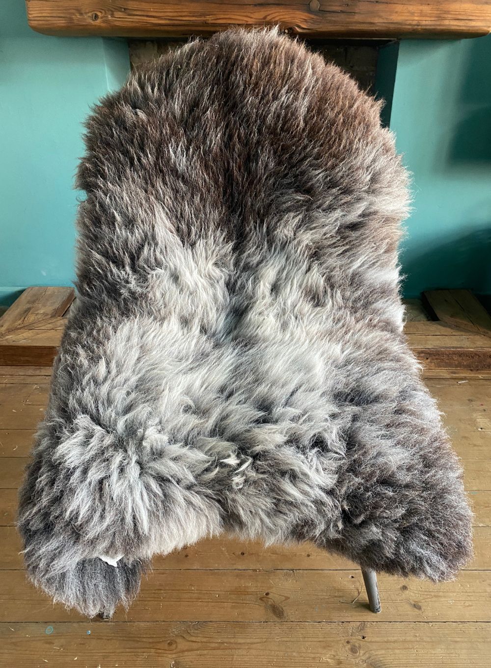 Brown and grey sheepskin rug on chair