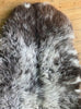 Brown and grey sheepskin rug close up
