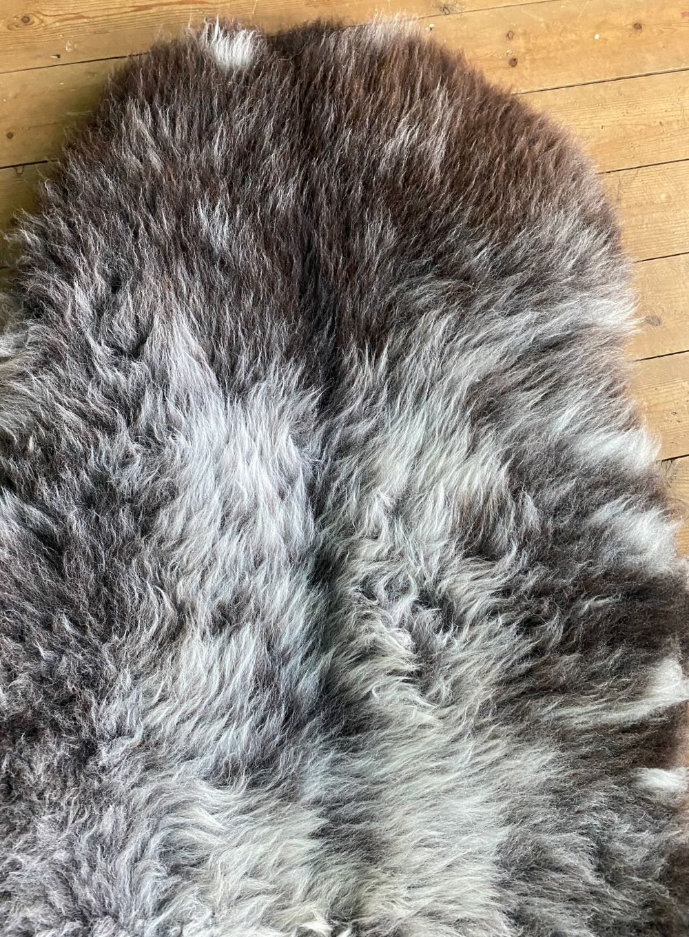 Brown and grey sheepskin rug close up