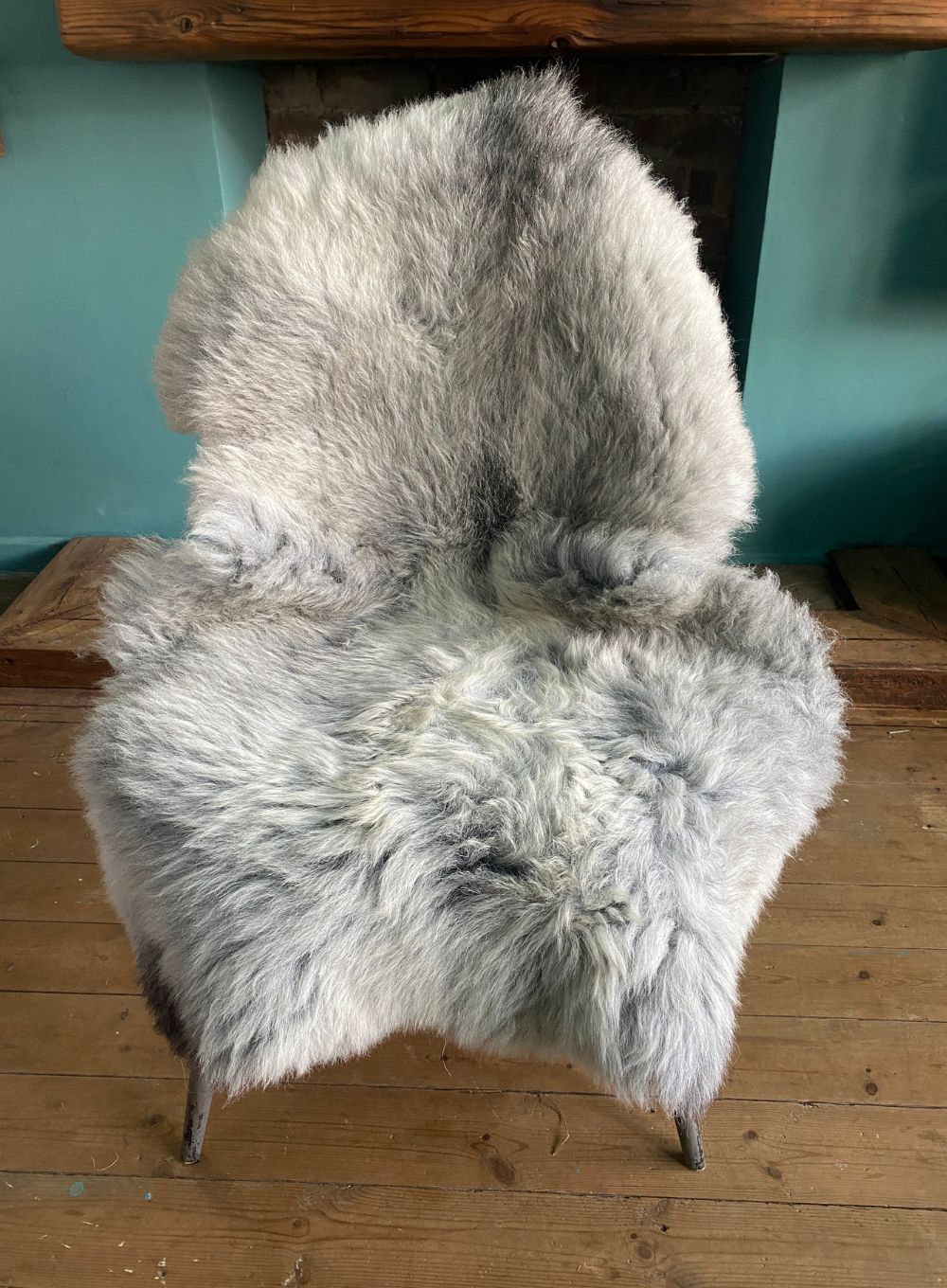 Grey sheepskin rug on chair