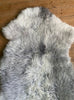 Grey sheepskin rug close up