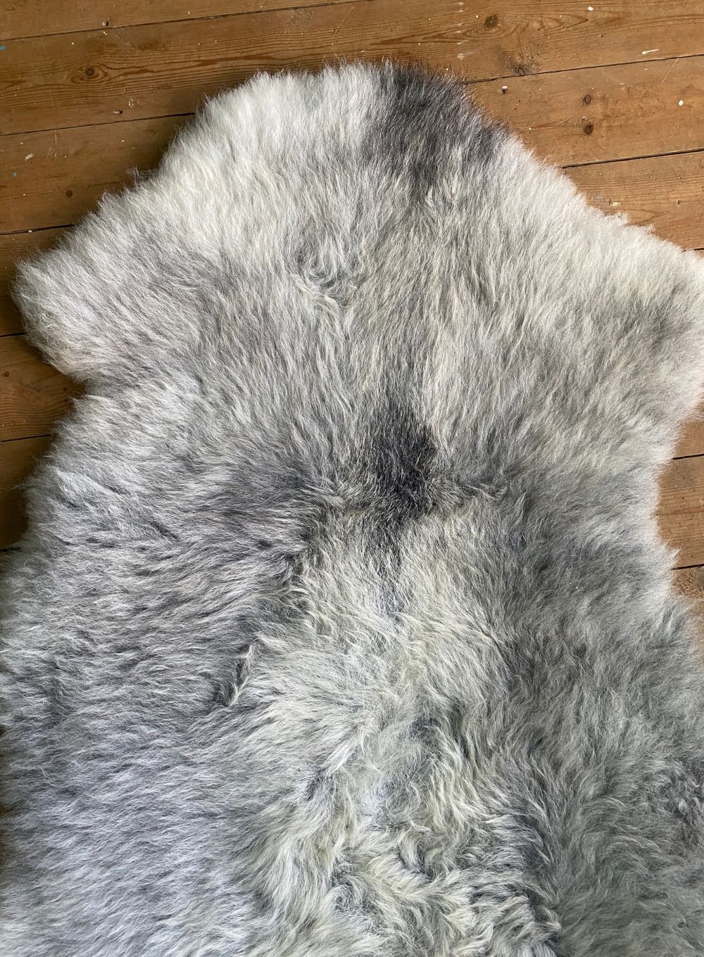 Grey sheepskin rug close up