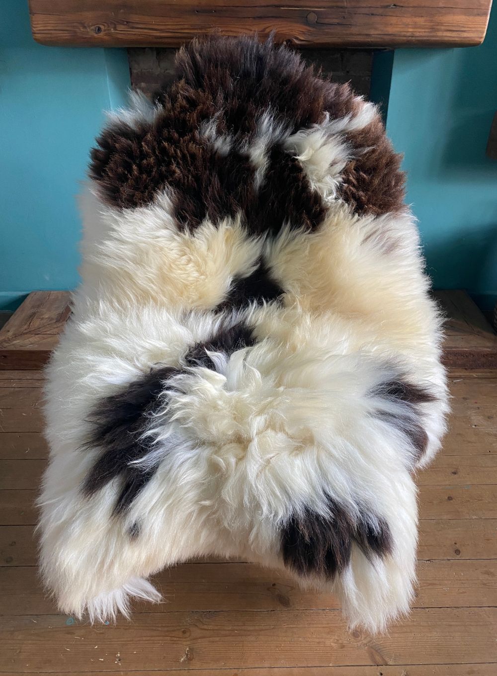 Brown and crem sheepskin rug on chair 