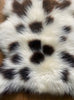 Cream and brown sheepskin rug close up